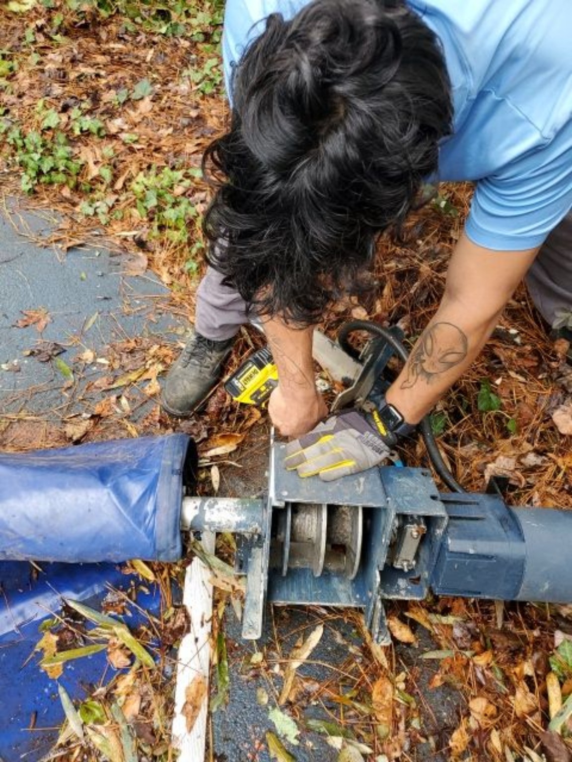 Crew member servicing pool-cover equipment