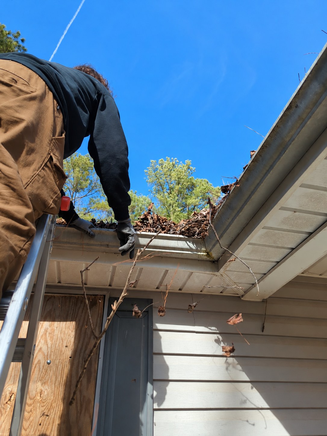 Gutter maintenance work at a residential property